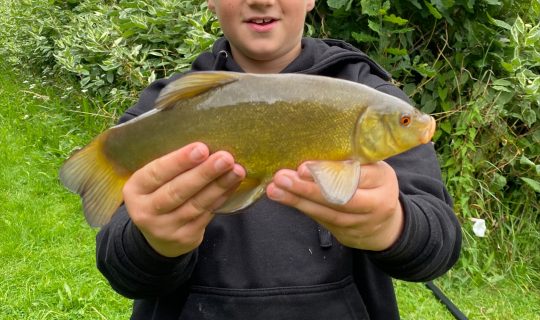 Another proud angler and another Tench